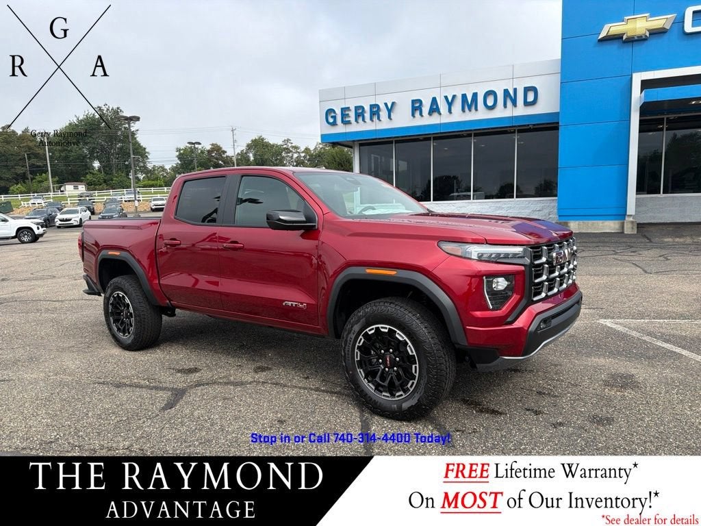 2026 GMC Canyon Crew Cab Short Box 4-Wheel Drive AT4 in Volcanic Red Tintcoat — front three-quarter view